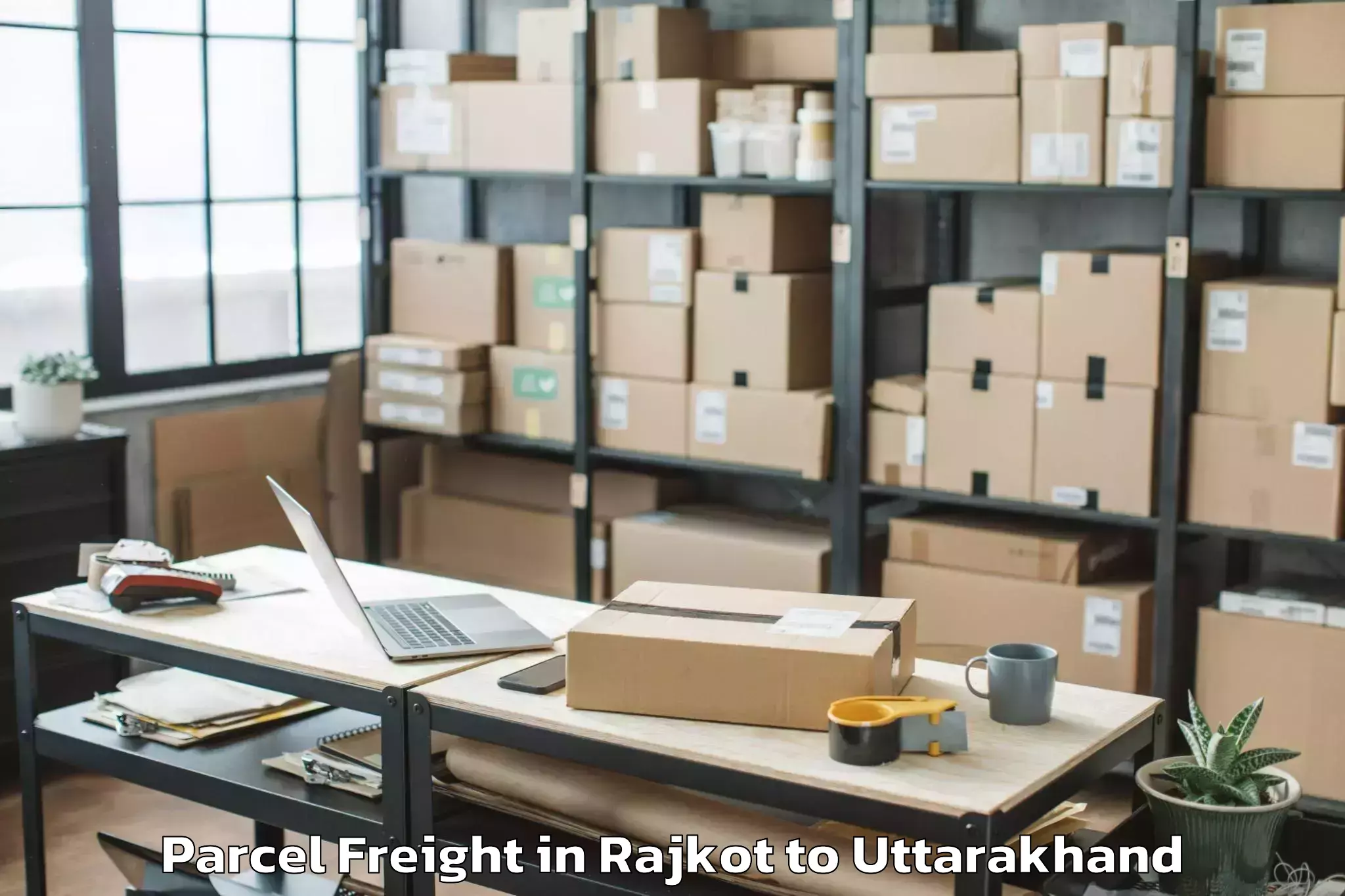 Book Rajkot to Doon University Dehradun Parcel Freight